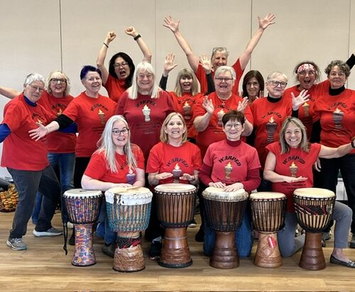 Smiling group of hand drummers