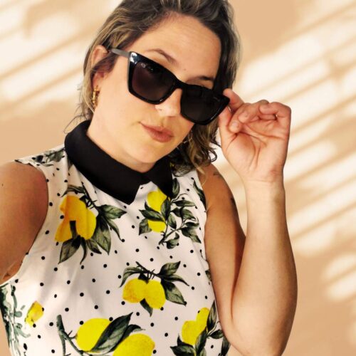 DJ Limoncella wearing a flowery top and sunglasses
